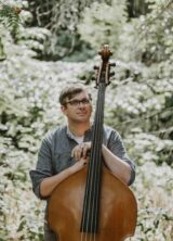 Musician holding a double bass